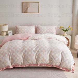 Epic Set Blush Checks luxury quilt set design and matching pillow covers styled in a modern bedroom interior.
