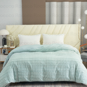 Feather Fold Aqua Blocks soft aqua textured double quilt on modern luxury bed setup